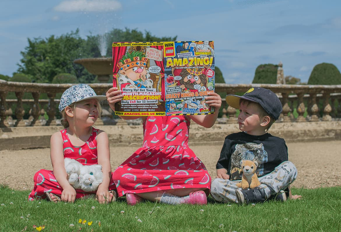 children outdoors with amazing magazine